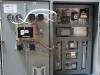 Inside a PLC panel with flame safety, motor starters, and VFD.